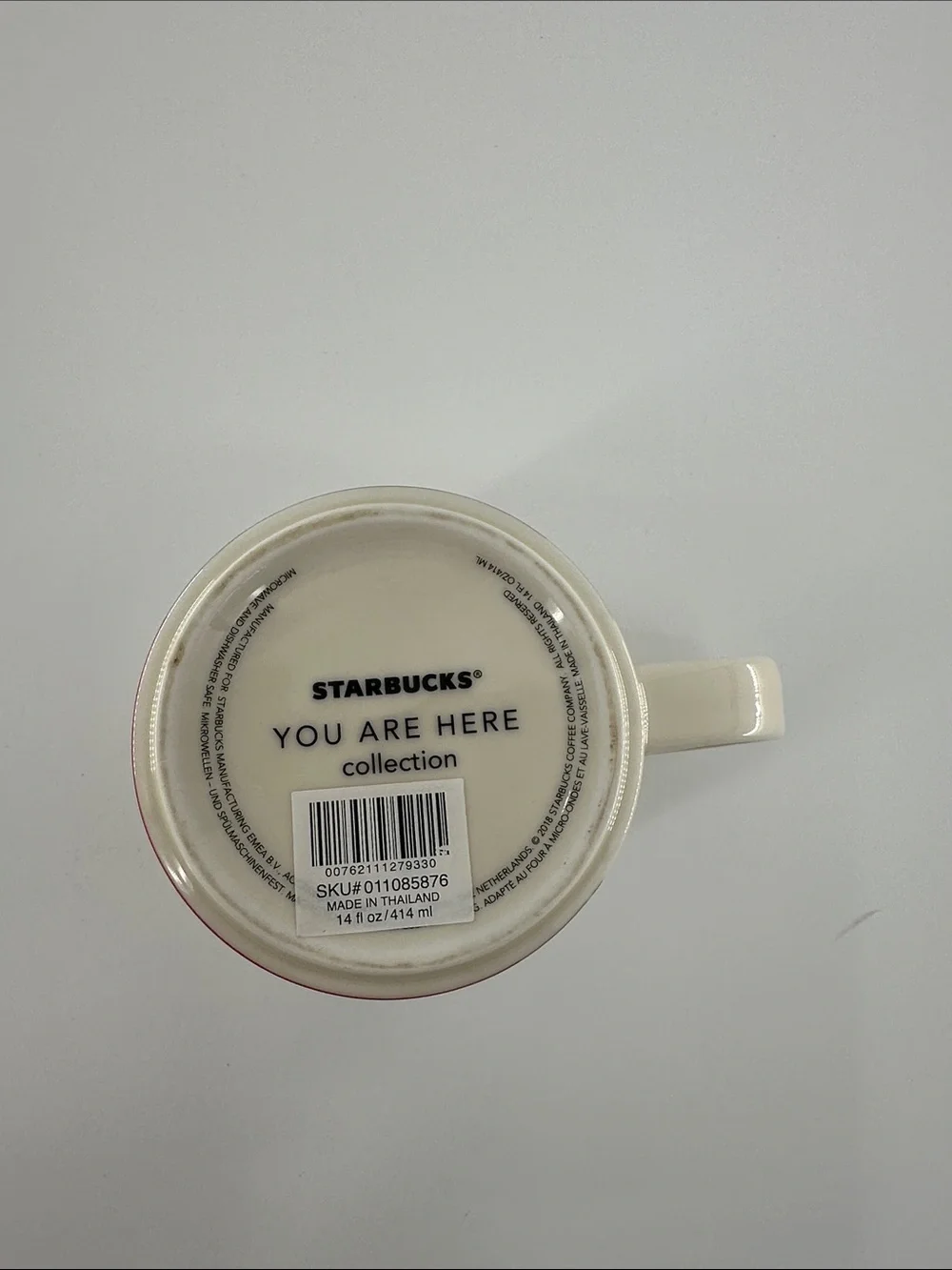 Starbucks Oman Cream Cityscape Mug with Orange Interior and Red Accents